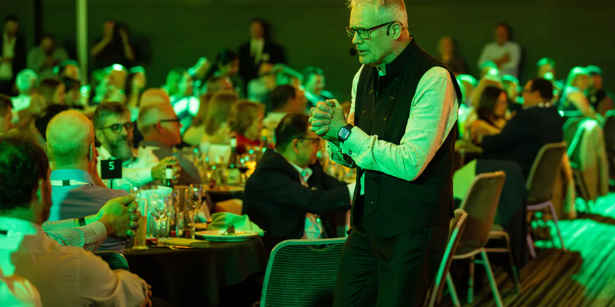 Gerard V delivering a keynote presentation at a professional conference